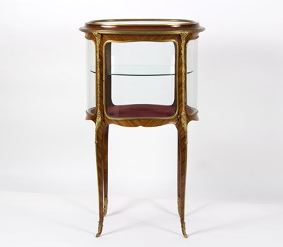 Lot 729 - An oval kingwood cabinet of Louis XVI design,...