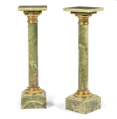 Lot 741 - A pair of green onyx columns with gilt brass...