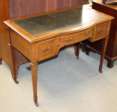 Lot 754 - An Edwardian mahogany bowfront writing table...