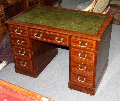 Lot 760 - A mahogany kneehole desk, crossbanded and...