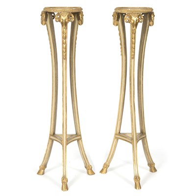 Lot 768 - A pair of Adam style parcel gilt torcheres,...