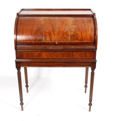 Lot 773 - A mahogany cylinder bureau, on reeded taper...