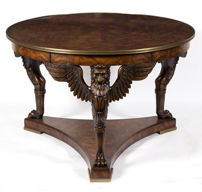 Lot 775 - A mahogany circular table by re.pli.ca, fitted...