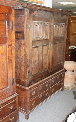 Lot 776 - An oak Bylaw wardrobe, enclosed by a pair of...