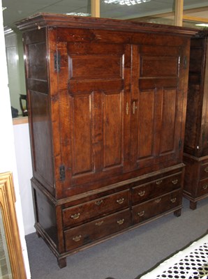 Lot 777 - An oak Bylaw wardrobe, enclosed by a pair of...