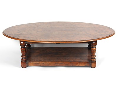 Lot 779 - An oak Bylaw oval coffee table, with platform...