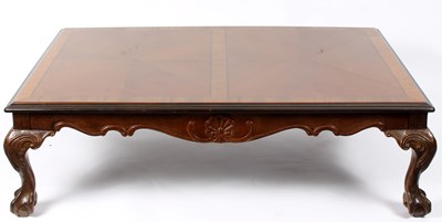 Lot 781 - A walnut coffee table with geometric top on...