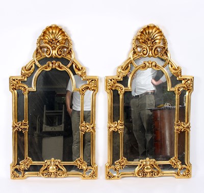 Lot 797 - A pair of gilded wall mirrors with shell...