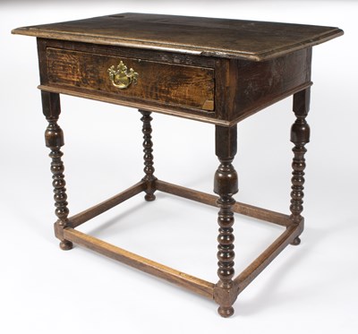 Lot 806 - A 17th Century oak side table, the top...