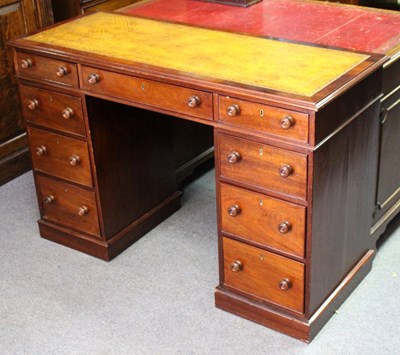 Lot 824 - A pedestal desk fitted with nine drawers...