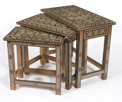 Lot 826 - A nest of three inlaid Eastern tables, the...