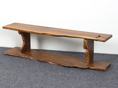 Lot 827 - A yew wood wall shelf by Reynolds of Ludlow,...