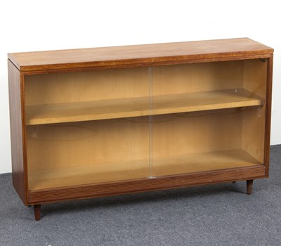 Lot 828 - A teak bookcase by White & Newton, enclosed by...