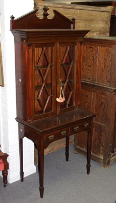 Lot 830 - An Edwardian mahogany display cabinet, the key...