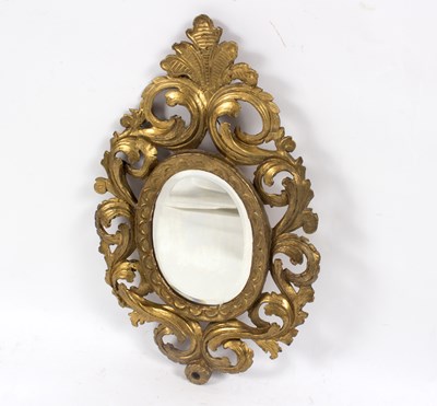 Lot 844 - An oval wall mirror in an early 19th Century...