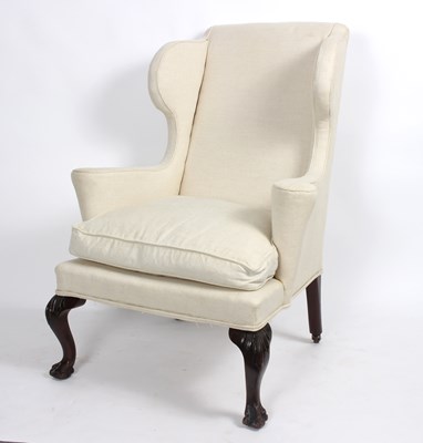 Lot 855 - An 18th Century style wing armchair, recently...