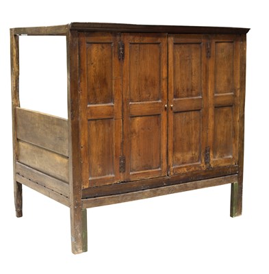 Lot 857 - A child's oak tester bed, one side enclosed by...