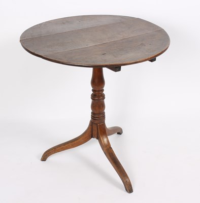 Lot 869 - A George III oak tripod table, 69cm wide