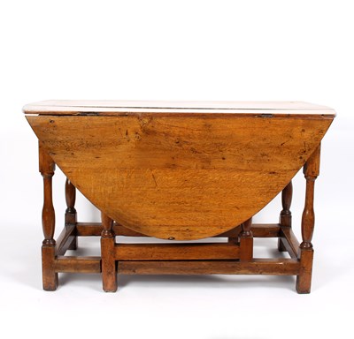 Lot 877 - An early 18th Century oak gateleg table with...