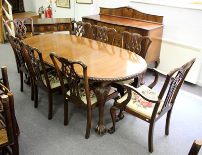 Lot 883 - A 1920s Chippendale revival mahogany dining...