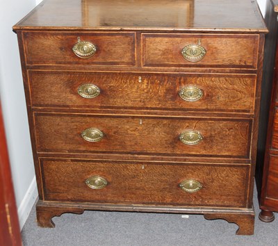 Lot 887 - A George III oak and inlaid chest of two short...