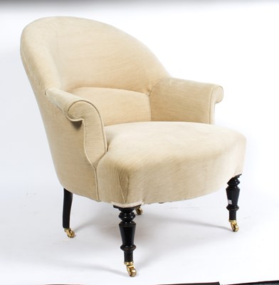 Lot 893 - An upholstered tub armchair