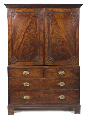 Lot 899 - A George III mahogany linen press, enclosed by...