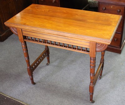 Lot 904 - A late Victorian fold-over card table with...