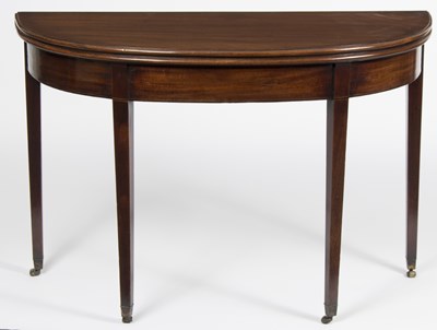 Lot 910 - A George III D-shaped fold-over tea table, on...