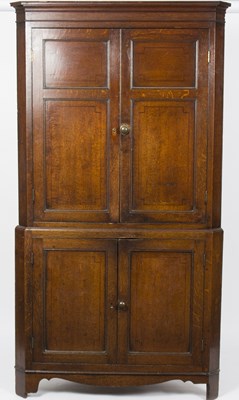 Lot 917 - A George III mahogany floor standing corner...