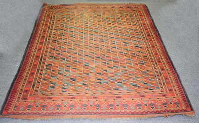 Lot 933 - An Eastern rug worked in blues and reds to a...