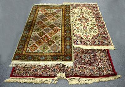 Lot 935 - A modern Tabris carpet worked in reds, yellows...