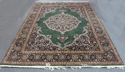 Lot 939 - An Eastern style carpet with central medallion...