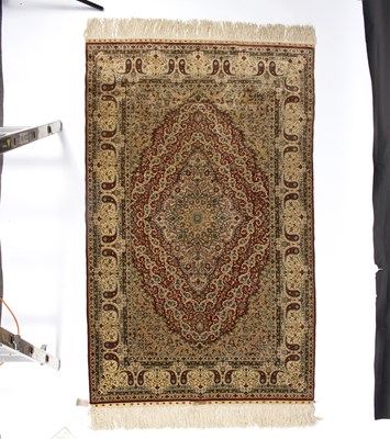 Lot 942 - An Isfahan silk rug with central medallions...