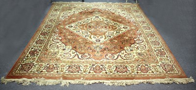 Lot 945 - A Chinese carpet, decorated foliate scrolls to...