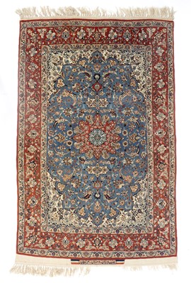 Lot 948 - An Isfahan rug with pale blue field, signed,...