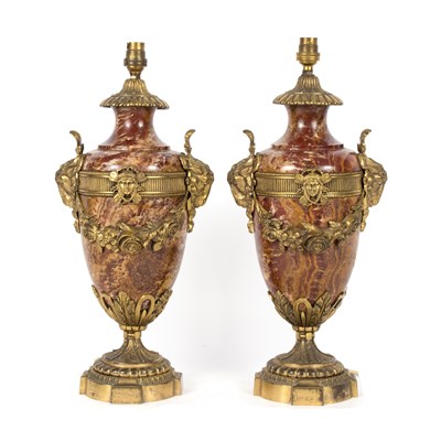 Lot 973 - A pair of red mottled marble vase shaped...