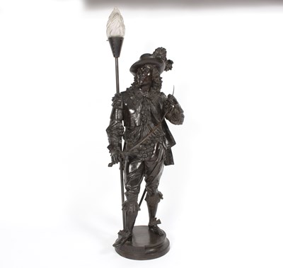 Lot 975 - A figural table light, the bronzed metal...