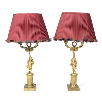 Lot 980 - A pair of Louis XVI style ormolu table lamps...