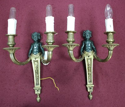 Lot 981 - A set of eight two-branch wall lights, each...