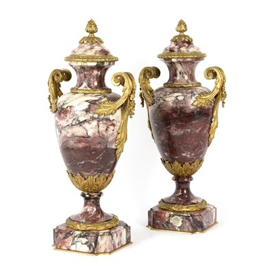 Lot 1005 - A pair of ruby red and white veined marble...