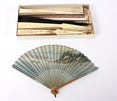 Lot 1040 - A French lace fan with ivory sticks and guards,...