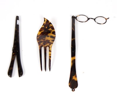 Lot 1050 - A black lace fan with tortoiseshell sticks, a...