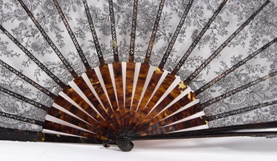 Lot 1050 - A black lace fan with tortoiseshell sticks, a...