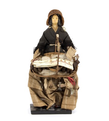 Lot 1074 - A Victorian pedlar doll wearing a straw bonnet...