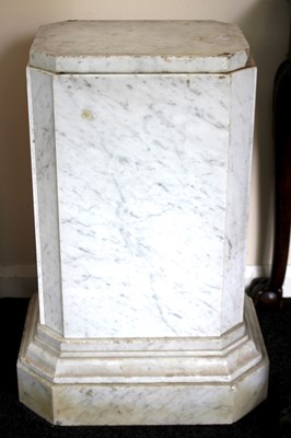 Lot 1075 - A squat rectangular marble column with canted...