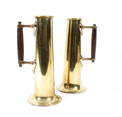 Lot 1079 - A pair of brass measures of tall tapered form...