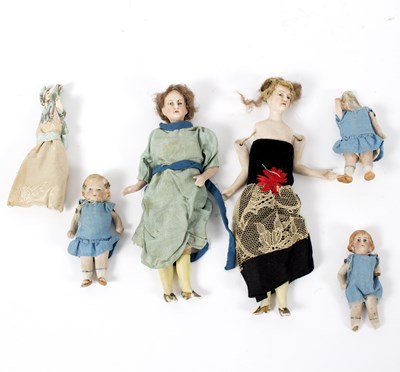 Lot 1100 - Two miniature dolls, with bisque upper bodies...