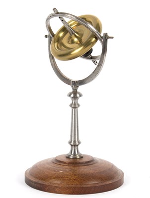 Lot 1108 - A steel and brass gyroscope, on circular...