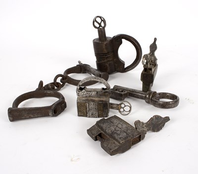 Lot 1110 - A pair of 19th Century handcuffs, a brass...